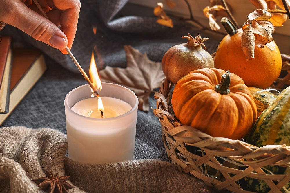 Lighting a candle with matches